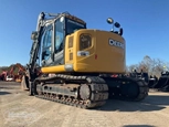 Used Deere Excavator in yard